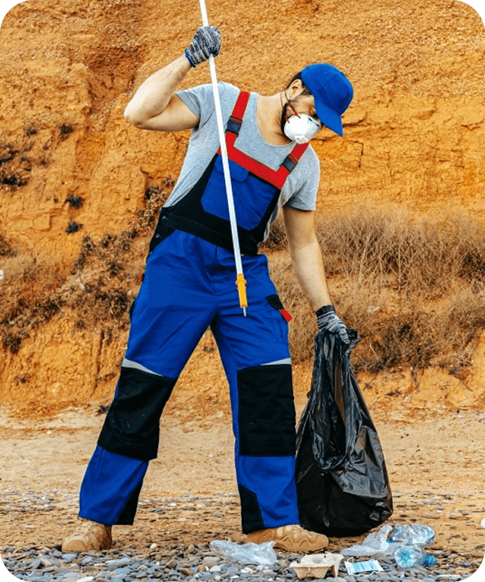 Worker cleaning up waste outdoors